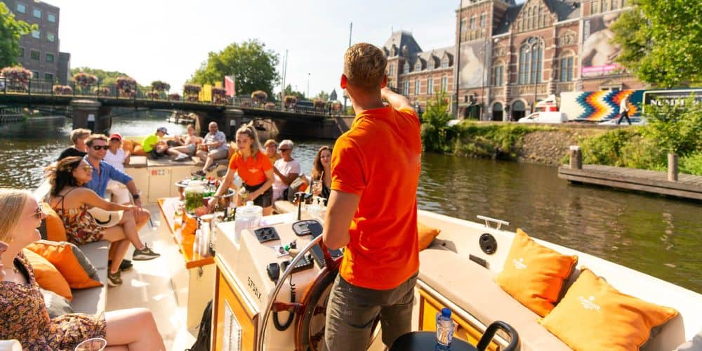 Luxe grachten rondvaart met gids Amsterdam