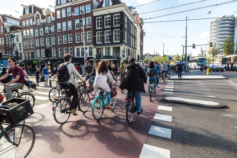 demographics Amsterdam 1 demographics Amsterdam. People riding on bikes.